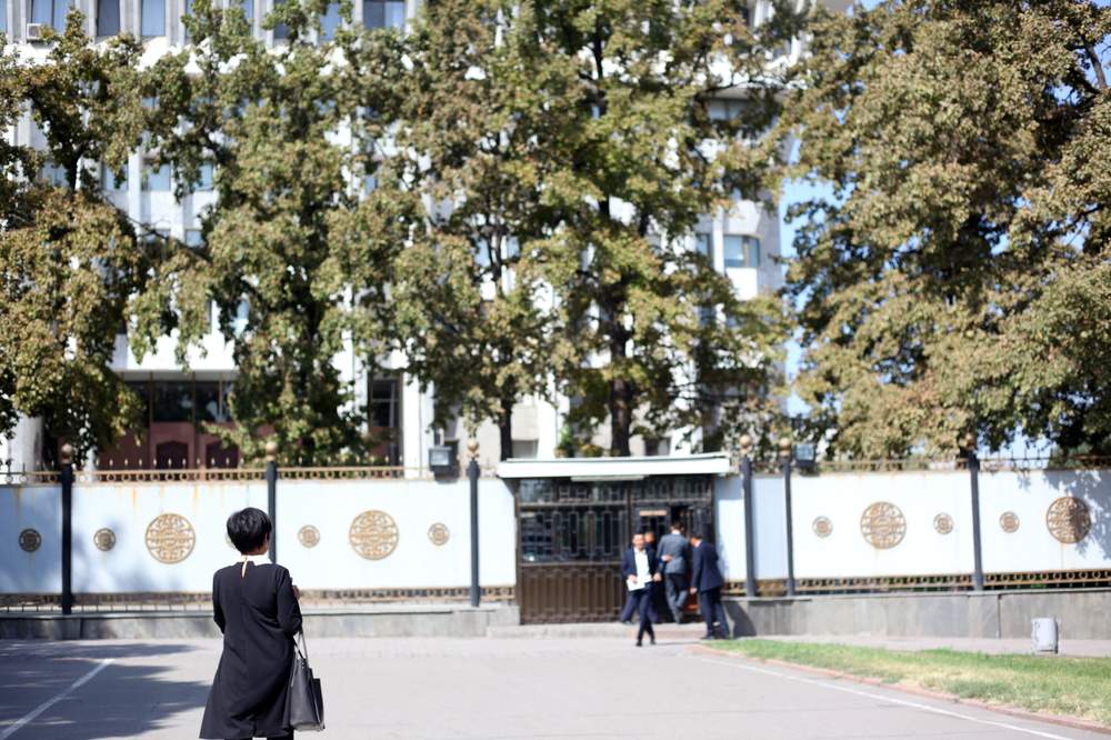 MP Aida Kasymalieva walks towards the entrance&amp;nbsp;of the parliament building in Bishkek, Kyrgyzstan.