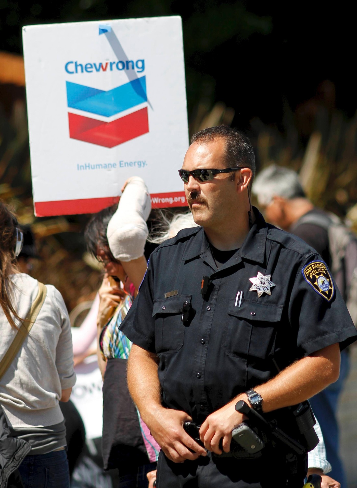 A San Ramon police Officer Keeps A Watchful Eye On Marchers During A