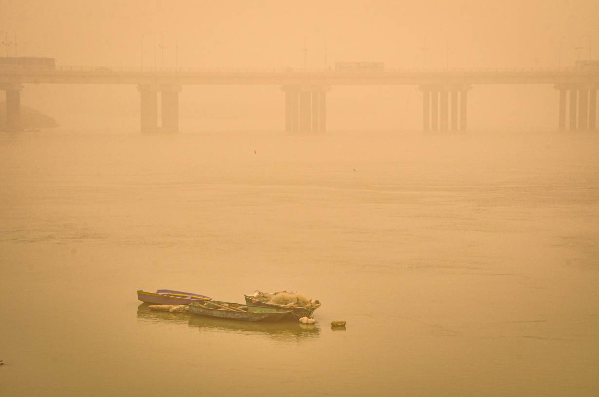 Boats on the Karun river blanketed in a thick haze during one of the increasingly frequent and intense sand and dust storms hitting the Middle East, in Ahvaz, Iran. Photo courtesy of Madyar Shojaeifar/Middle East Images