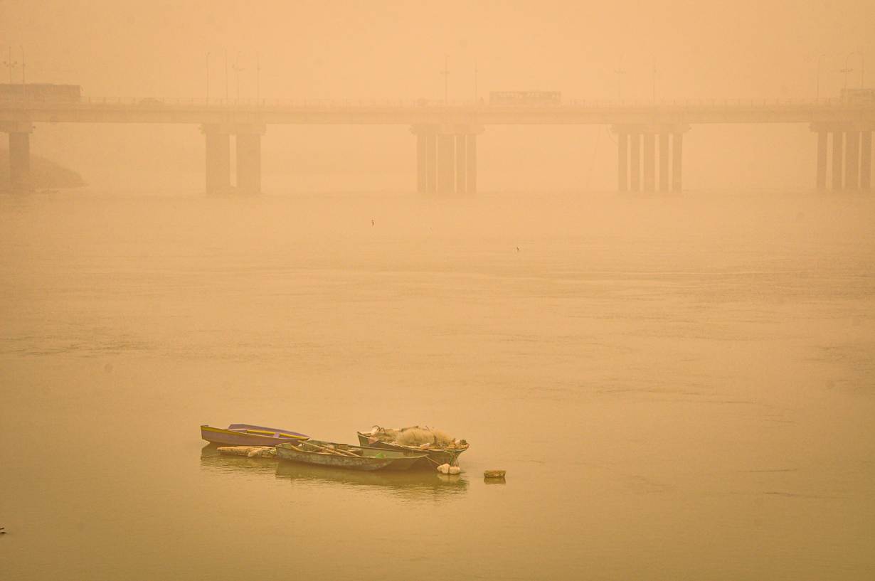 Boats on the Karun river blanketed in a thick haze during one of the increasingly frequent and intense sand and dust storms hitting the Middle East, in Ahvaz, Iran. Photo courtesy of Madyar Shojaeifar/Middle East Images