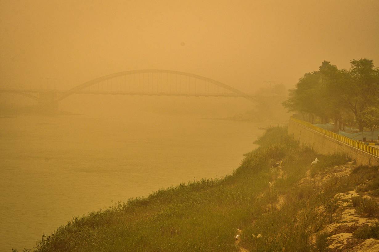 A bridge over the Karun river is blanketed in a thick haze during one of the increasingly frequent and intense sand and dust storms hitting the Middle East, in Ahvaz, Iran. Photo courtesy of Madyar Shojaeifar/Middle East Images