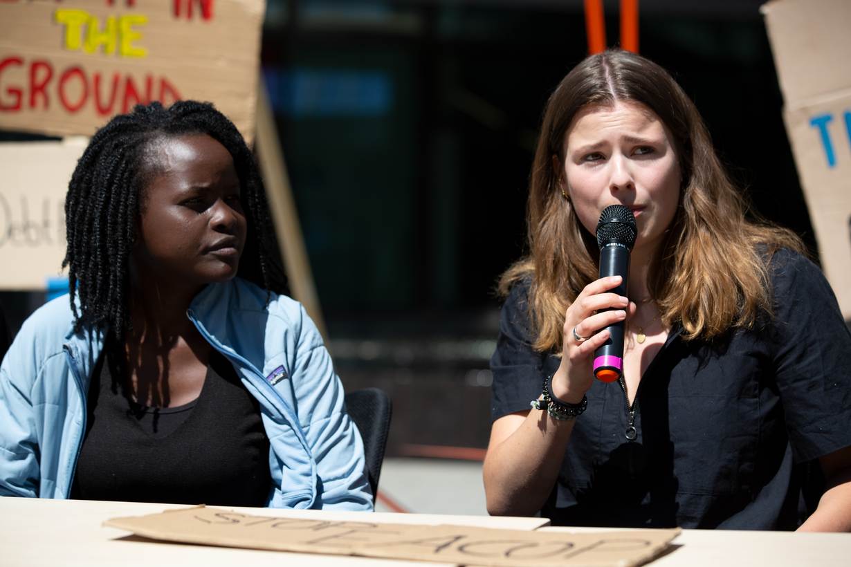 Youth activists Evelyn Ocham and Luisa Neubauer hold a press conference outside Deutsche Bank in Frankfurt after meeting CEO Christian Sewing. June 28, 2022. HANDOUT/Hosam Katan