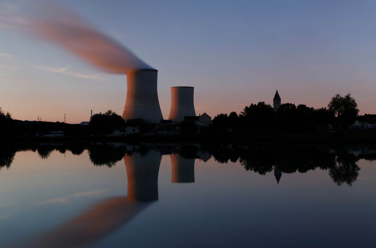 Steam rises from a cooling tower of the Electricite de France (EDF) nuclear power station in Civaux, France, October 8, 2021. Picture taken with long exposure. REUTERS/Stephane Mahe