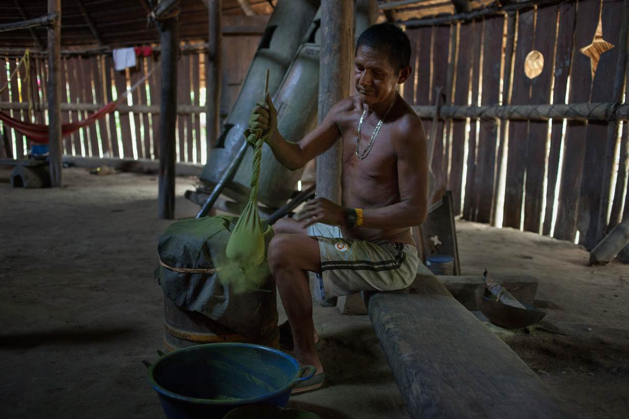 An indigenous man prepares powdered coca leaves used in the age-old mambe ritual, Puerto Libre riverside community, Amazonas province, Miriti- Parana, Colombia, December 16, 2021. Thomson Reuters Foundation/Fabio Cuttica