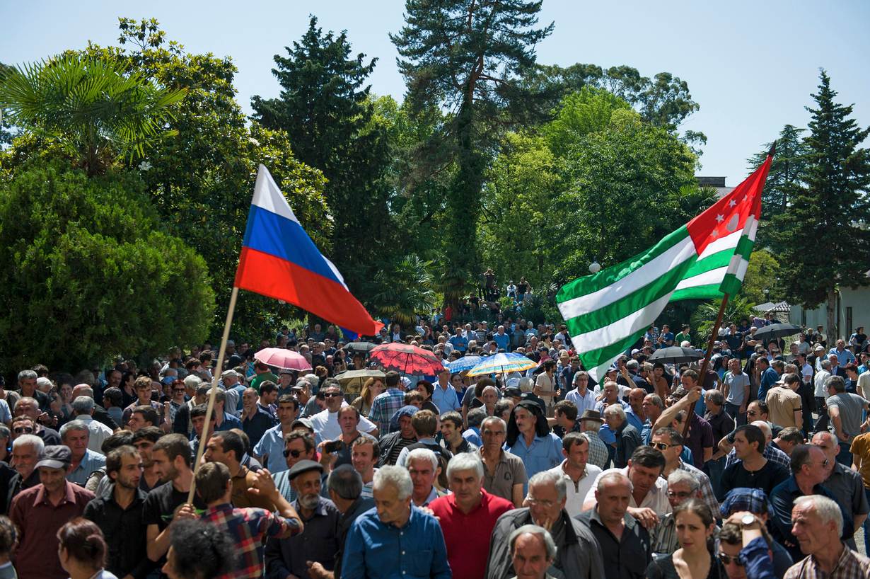 Opposition protesters gather outside the presidential headquarters in Sukhumi, the capital of Georgia's breakaway region of Abkhazia May 28, 2014. REUTERS/Nina Zotina.