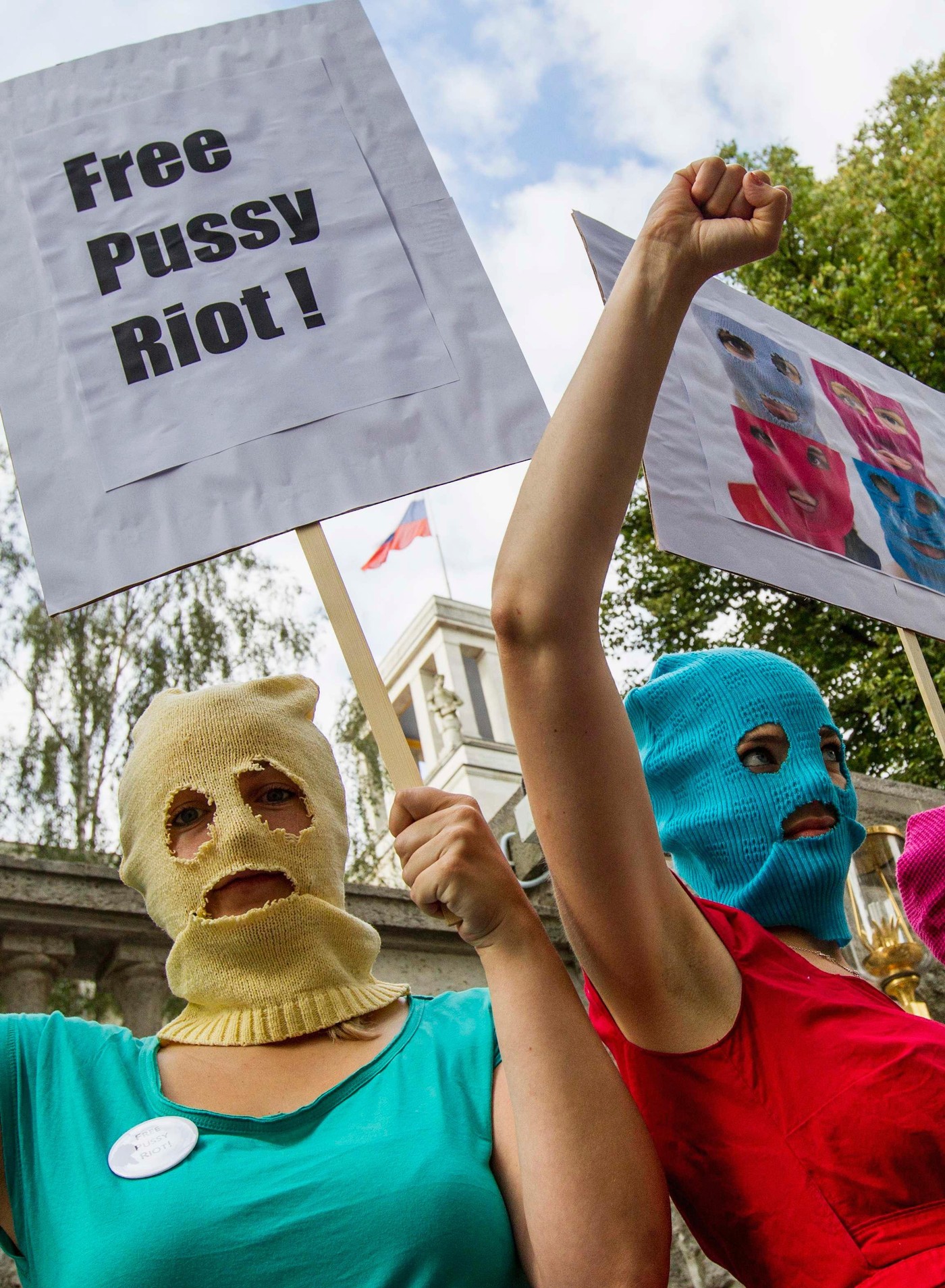 Protesters Wear Balaclavas And Colourful Dresses In The Style Of The Russian Punk Band Pussy