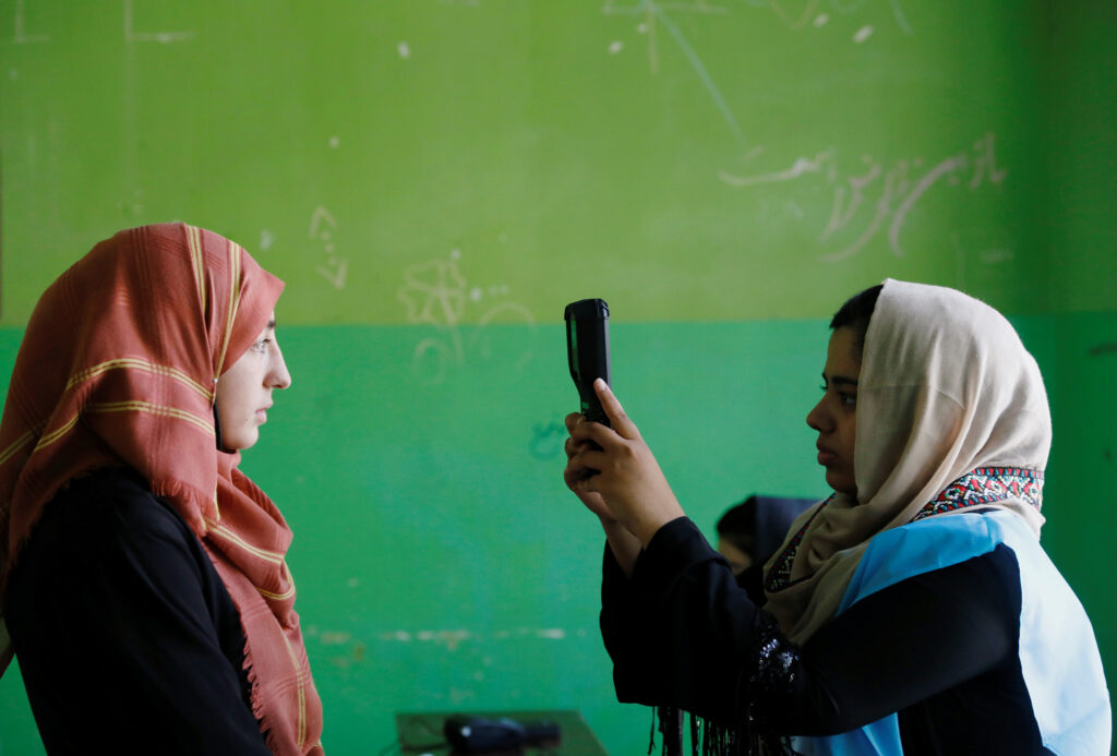 A year on, Afghans hide out fearing death by data