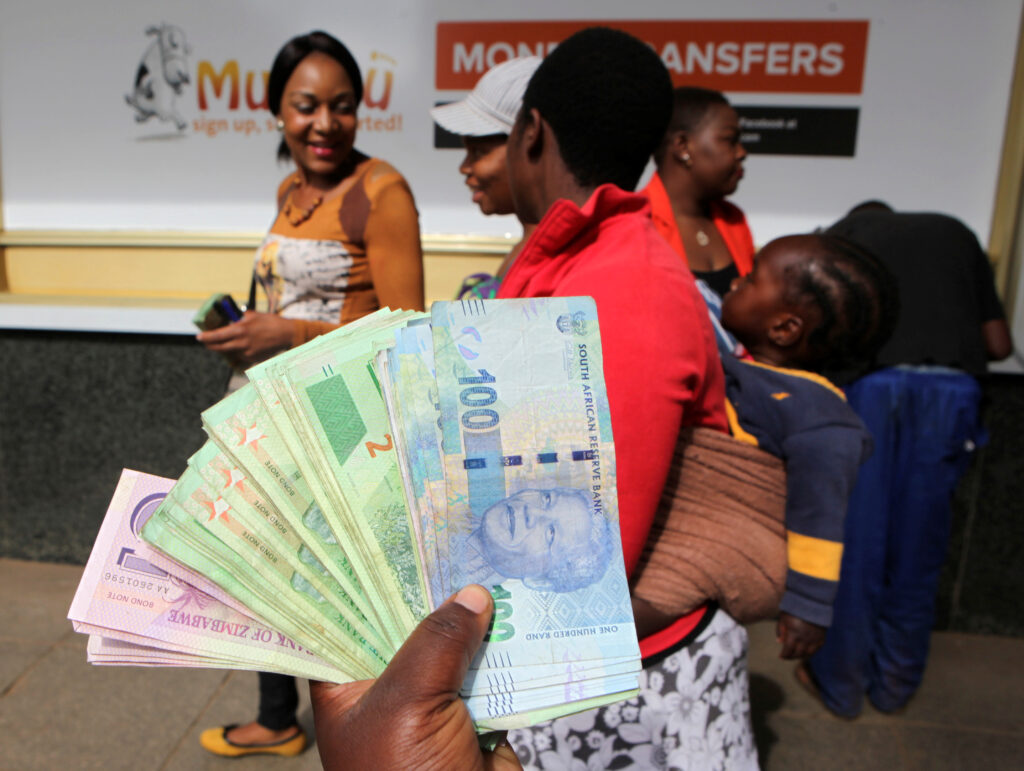 FEATURE-Backyard savings clubs on the money amid Zimbabwe cash crisis