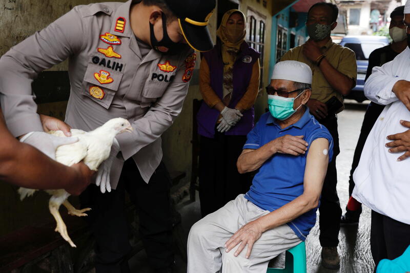 Carrot or stick? How countries are tackling COVID-19 vaccine hesitancy
