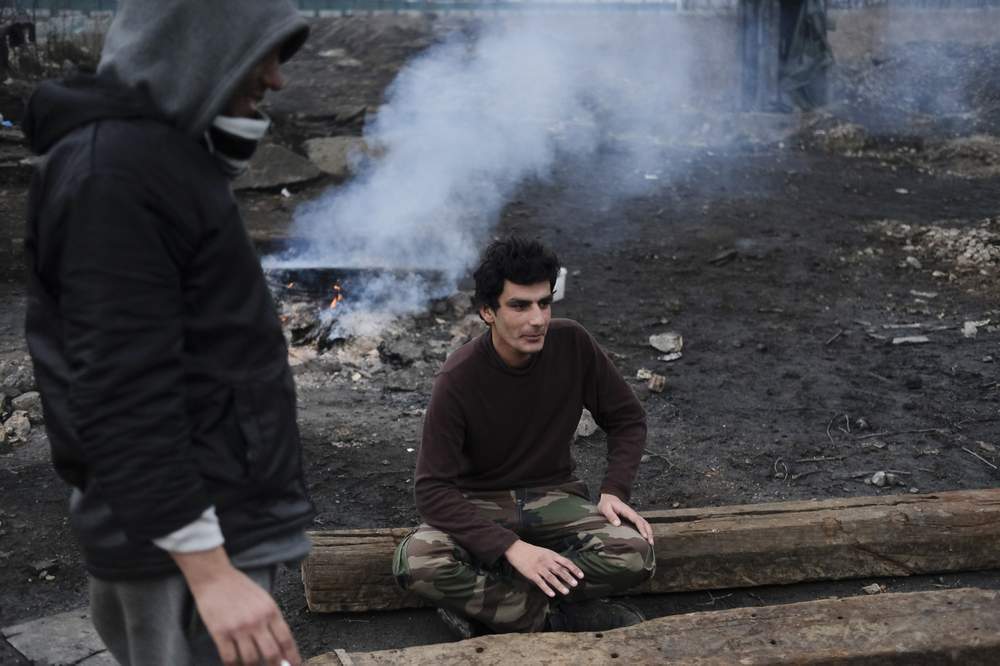 Ahmad Shakib sitting outside a large, abandoned warehouse near the main railway station in Serbia&#39;s capital Belgrade.&amp;nbsp;