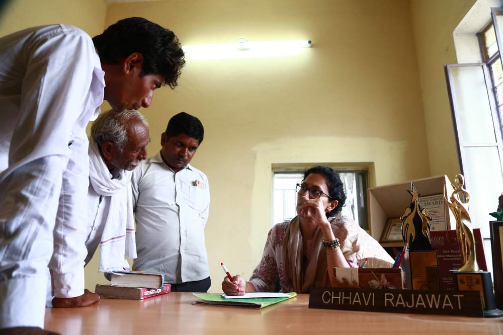 Chhavi Rajawat [seated] in her office in Soda village, Rajasthan, India.Rajawat made history as India&#39;s youngest elected village leader in 2010.